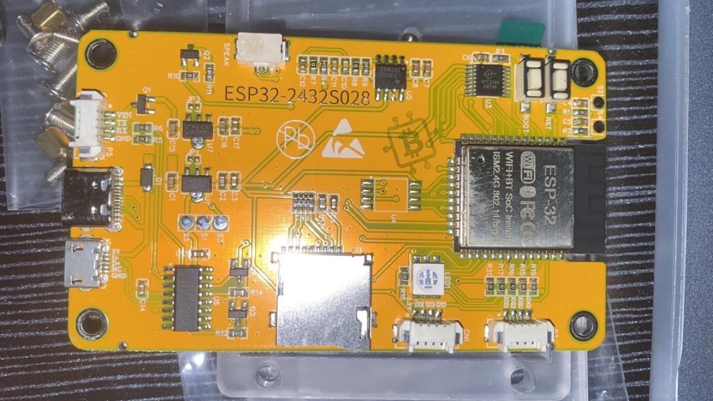 The bare board — an ESP32-2432S028R "Cheap Yellow Display": the ESP32 module, XPT2046 touch controller, and a microSD slot